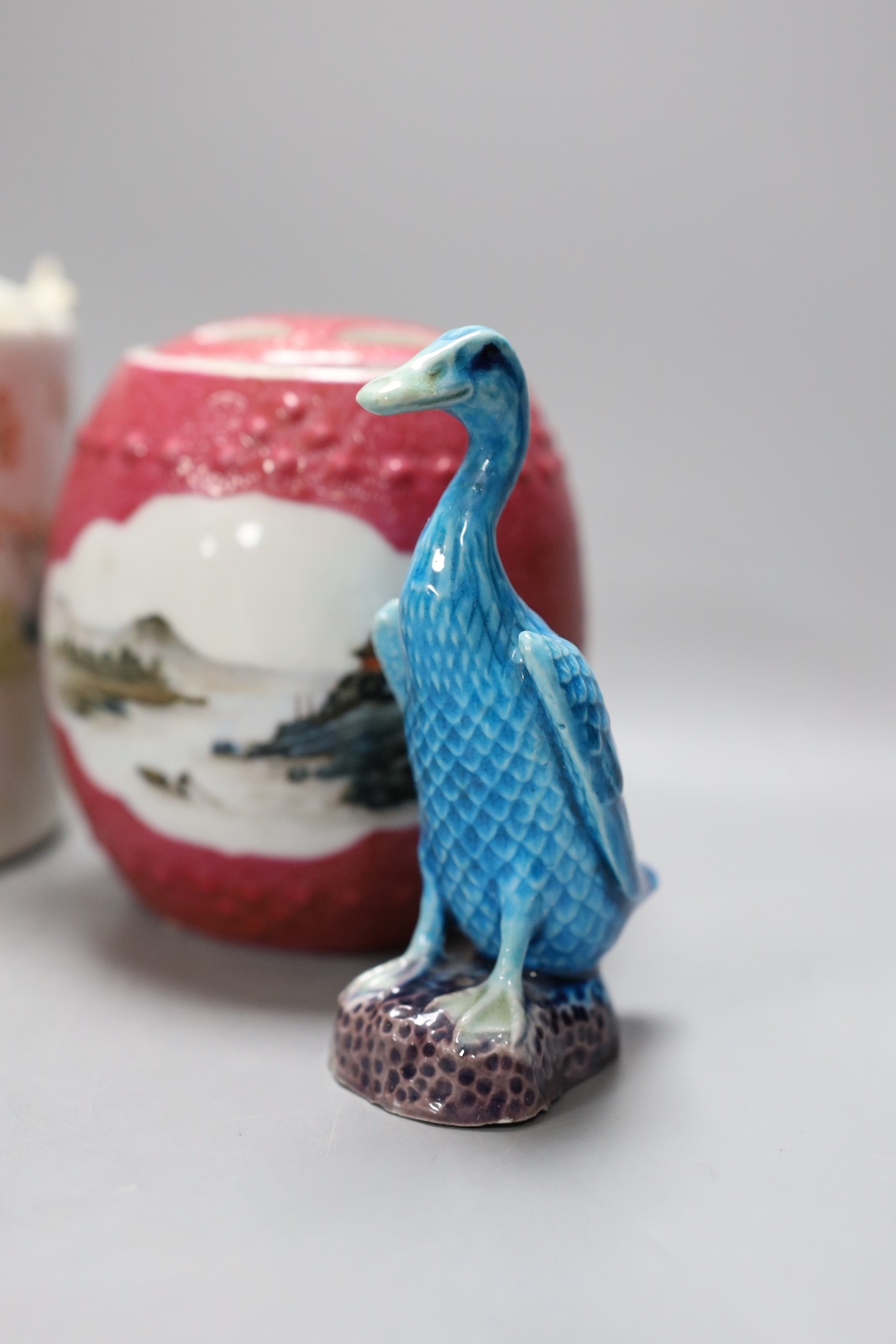 A Chinese Republic period teapot, a famille rose barrel and cover, a famille verte saucer, porcelain duck, pottery stem bowl and a resin model of Shou Lao